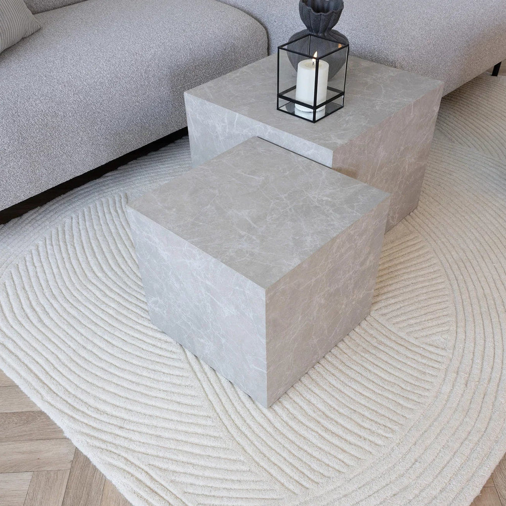 Beige textured rug on a wooden floor