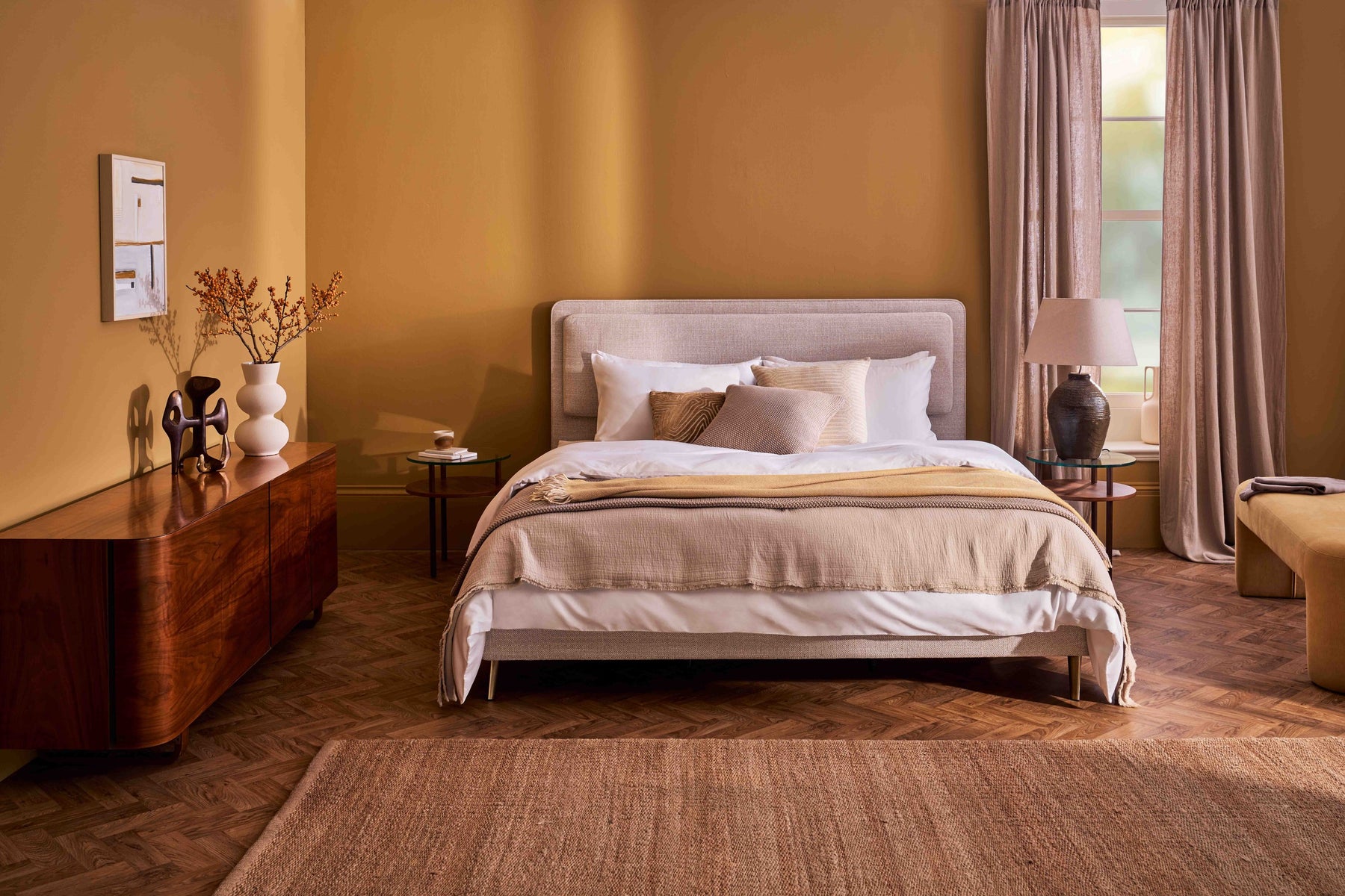 The fully dressed Vispring bed, with topper, linens and pillows