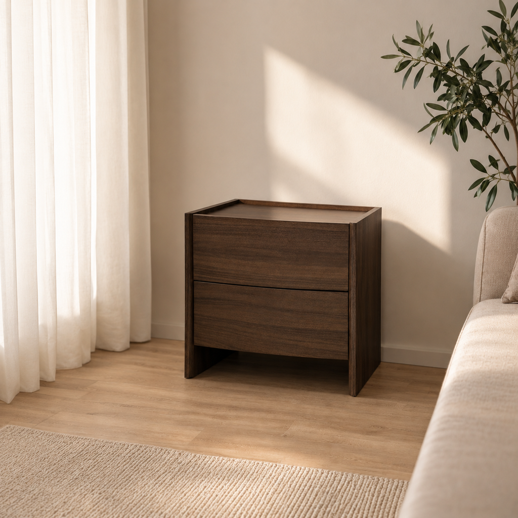 Wooden nightstand in a room with a couch and plant