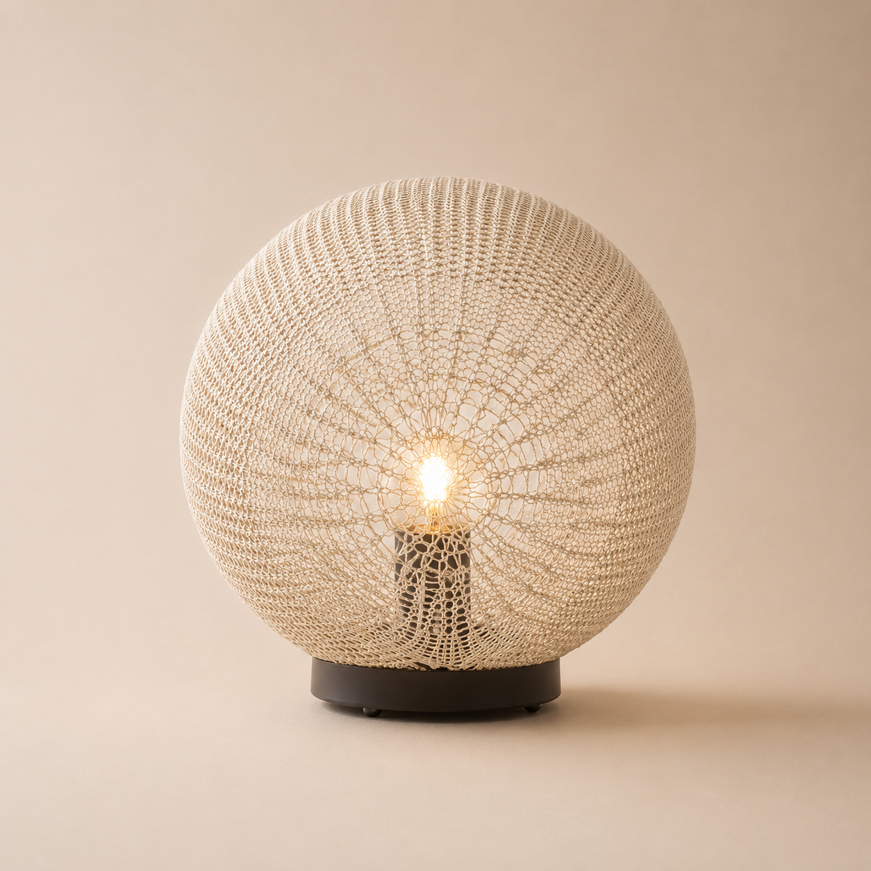 Spherical woven lamp on a beige background