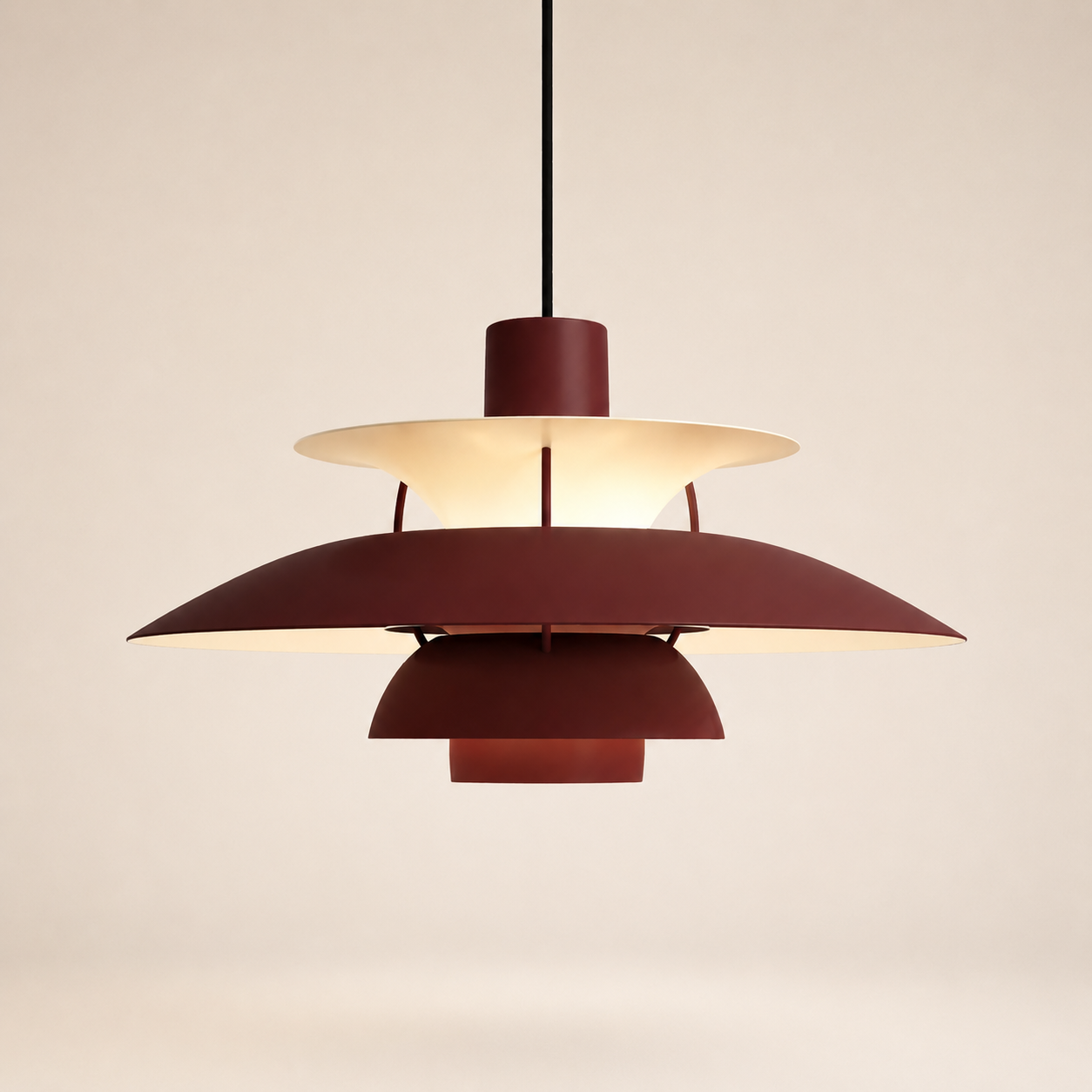 A Louis Poulsen PH 5 pendant lamp in deep red