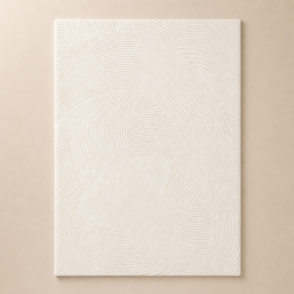 Textured white painting on a beige wall