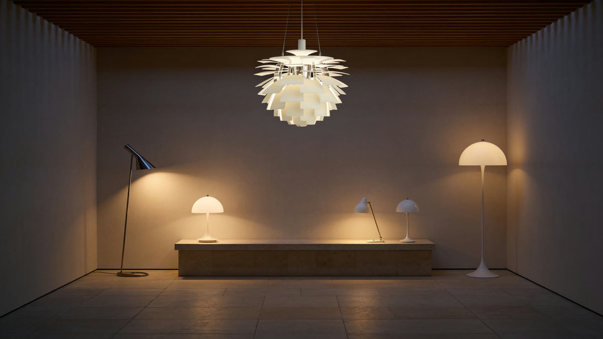 A dim showroom at dusk with Louis Poulsen pendant, floor and table lamps lit