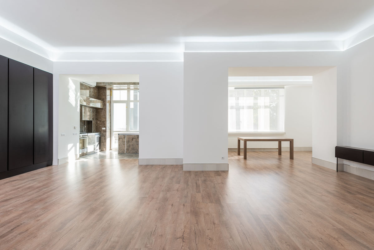 An empty room with a timber floor, waiting to be filled