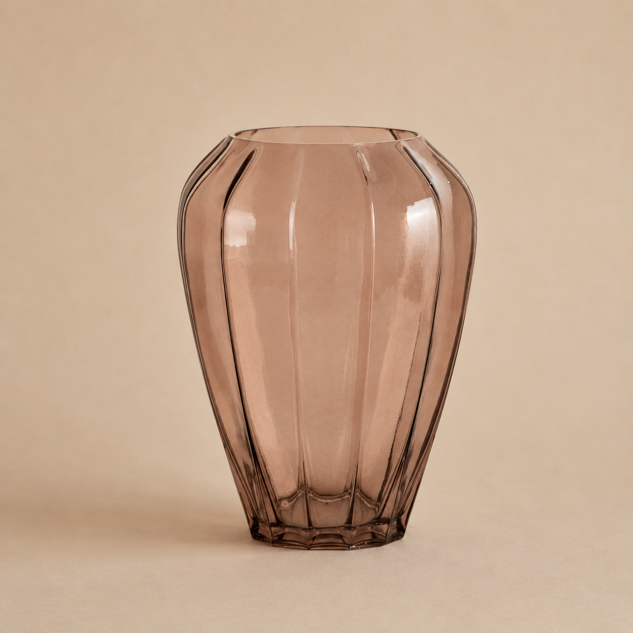 Brown glass vase on a beige background