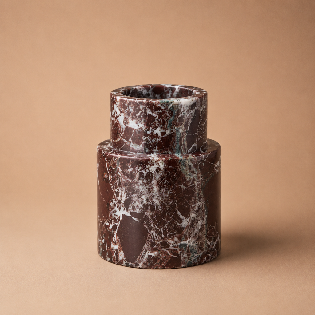Marble-textured cylindrical vase on a beige background