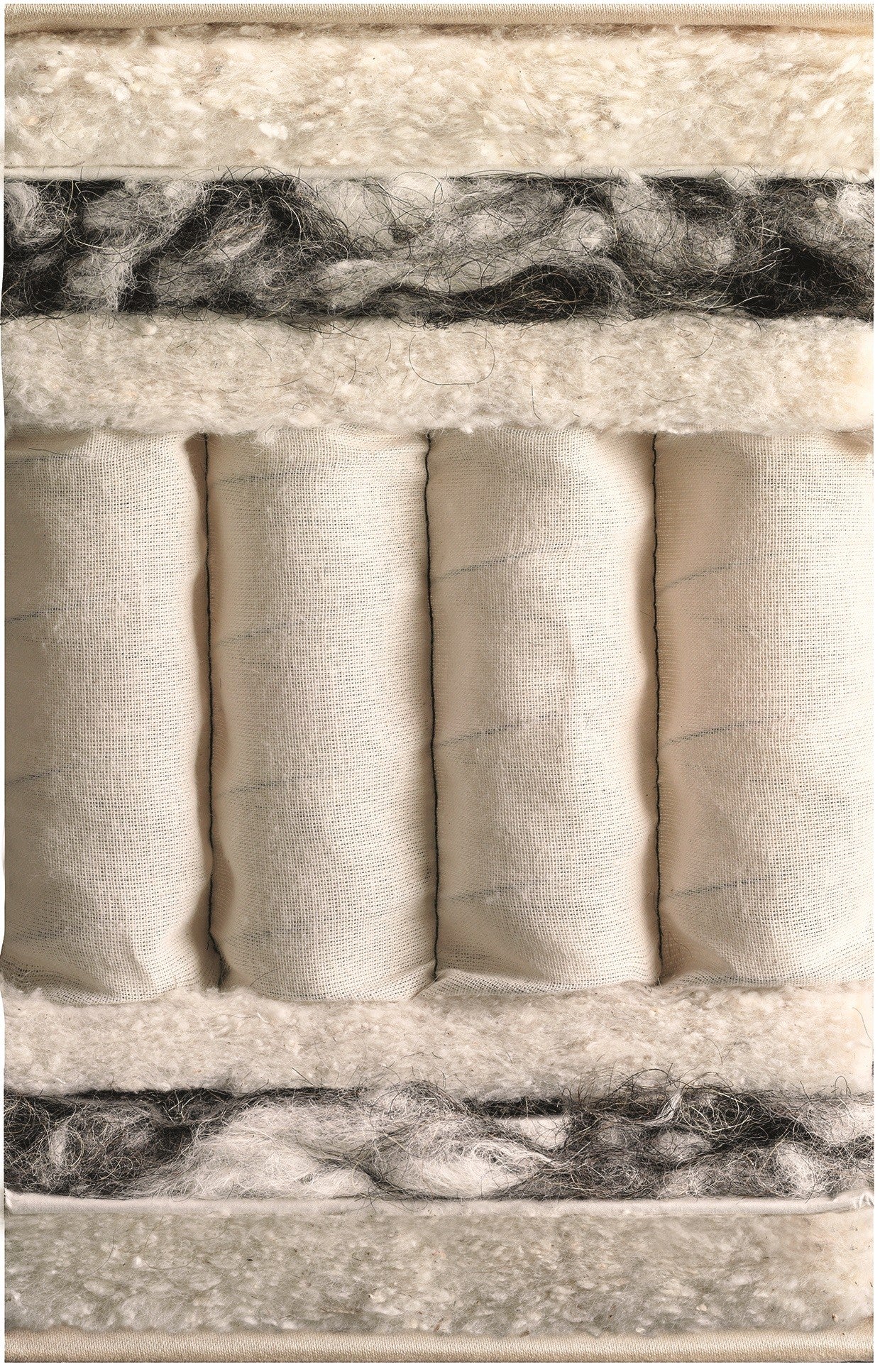Cut-through of a Vispring mattress showing wool, horsehair and hand-nested pocket springs